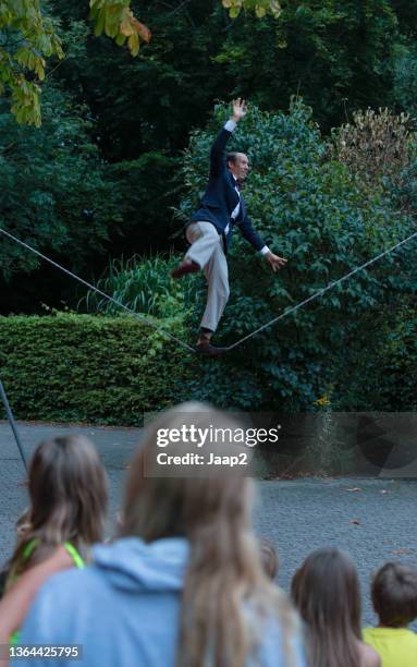 Tight Rope Playing Instruments Lovers On A Tightrope Photos and Premium High Res Pictures - Getty Images
