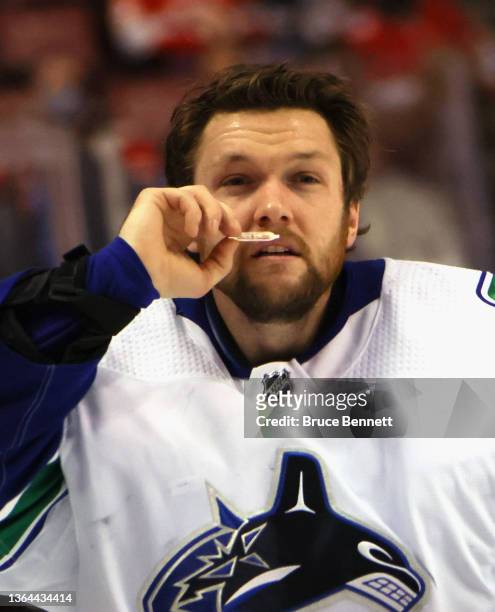 Thatcher Demko of the Vancouver Canucks takes in some smelling salts prior to playing in his 100th NHL game against the Florida Panthers at the...