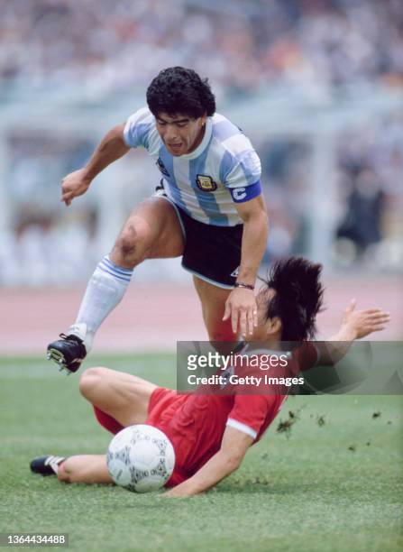 Diego Maradona of Argentina rides a South Korean tackle during the Group A match at the 1986 FIFA World Cup on 2nd June 1986 at the Olympic Stadium...