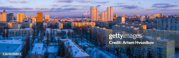 sunset scenic cityscape in kyiv city. orange light fall on rooftops of buildings - kyiv skyline stock pictures, royalty-free photos & images