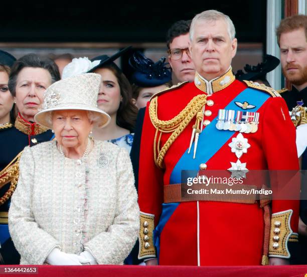 Queen Elizabeth II and Prince Andrew, Duke of York watch a flypast from the balcony of Buckingham Palace during Trooping The Colour, the Queen's...