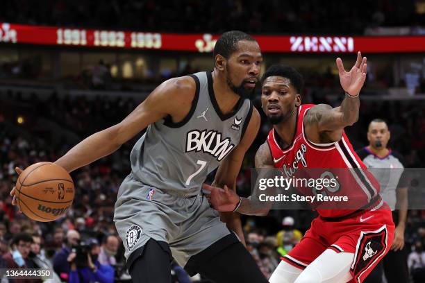 Kevin Durant of the Brooklyn Nets is defended by Alfonzo McKinnie of the Chicago Bulls during a game at United Center on January 12, 2022 in Chicago,...