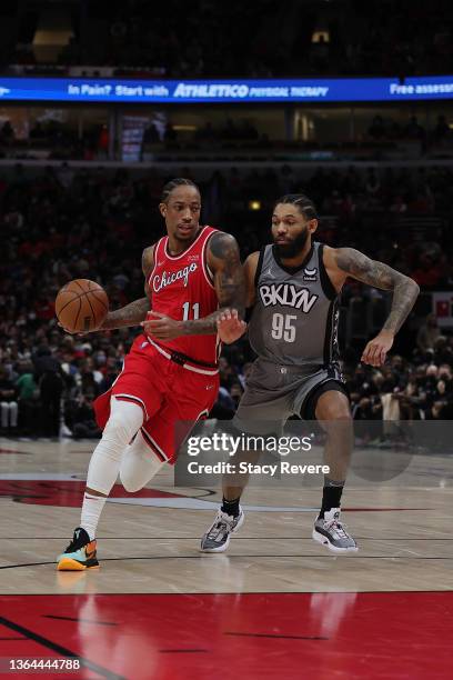 DeMar DeRozan of the Chicago Bulls is defended by DeAndre' Bembry of the Brooklyn Nets during a game at United Center on January 12, 2022 in Chicago,...