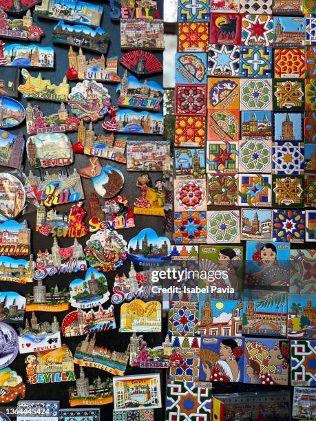 fridge magnets for sale at street market, sevilla, spain - fridge magnet stock pictures, royalty-free photos & images