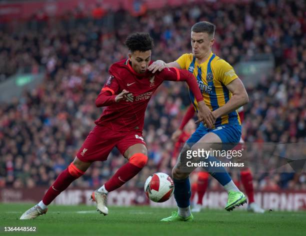 Kaide Gordon of Liverpool and George Nurse of Shrewsbury Town in action during the Emirates FA Cup Third Round match between Liverpool and Shrewsbury...
