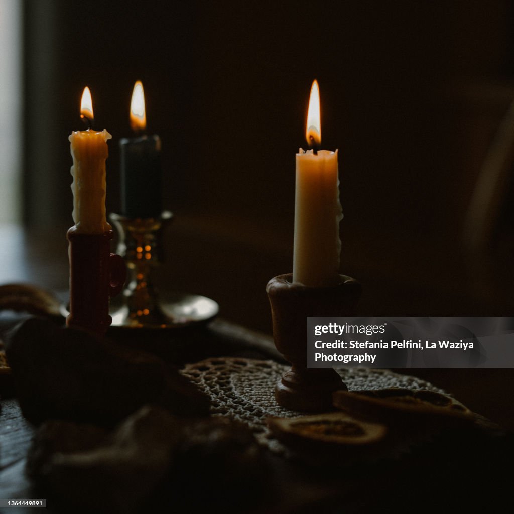 Three Lit Beeswax Candles