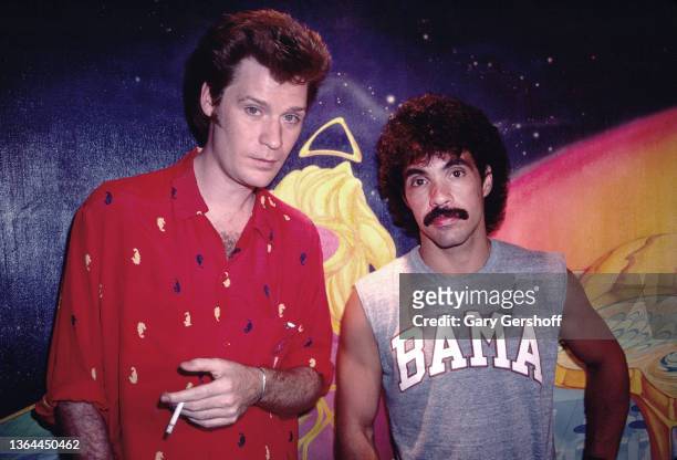 Portrait of America Pop musicians Daryl Hall and John Oates, of the duo Hall and Oates, as they pose together at Electric Lady Studios in Greenwich...