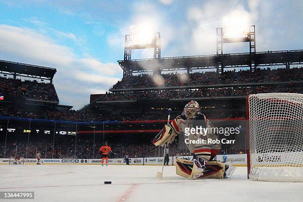 Henrik Lundqvist of the New York Rangers defends the net against the Philadelphia Flyers during the 2012 Bridgestone NHL Winter Classic at Citizens...