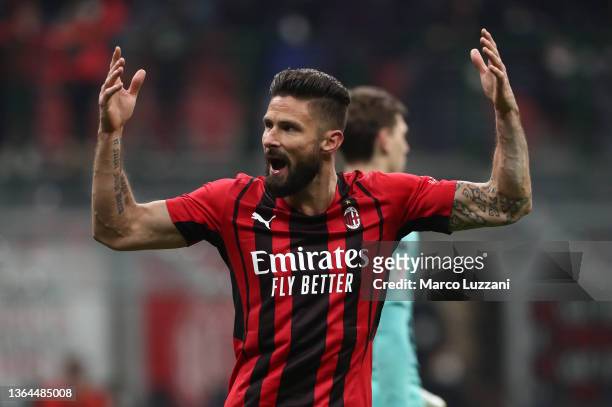 Olivier Giroud of AC Milan celebrates after scoring his side's opening goal during the Coppa Italia match between AC Milan and Genoa CFC at Stadio...