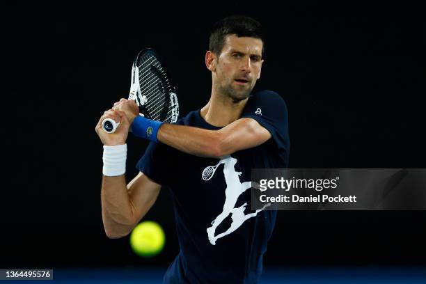 Novak Djokovic of Serbia plays a backhand during a practice session ahead of the 2022 Australian Open at Melbourne Park on January 14, 2022 in...