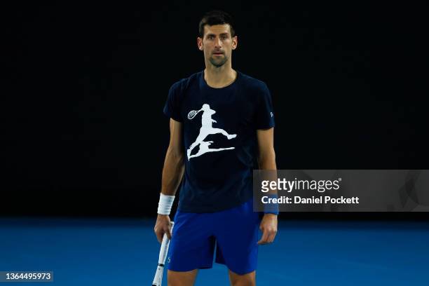 Novak Djokovic of Serbia looks on during a practice session ahead of the 2022 Australian Open at Melbourne Park on January 14, 2022 in Melbourne,...