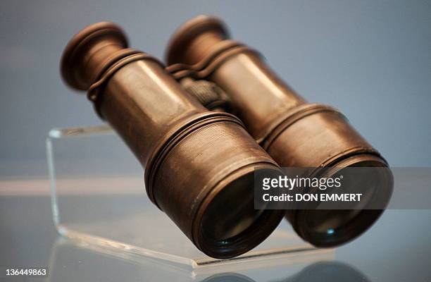 Pair of binoculars from the RMS Titanic is on display during a news conference by Guernsey's Auction House January 5, 2012 aboard the Intrepid Sea,...