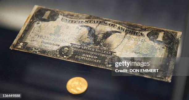 Silver certificate from the RMS Titanic is on display during a news conference by Guernsey's Auction House January 5, 2012 aboard the Intrepid Sea,...
