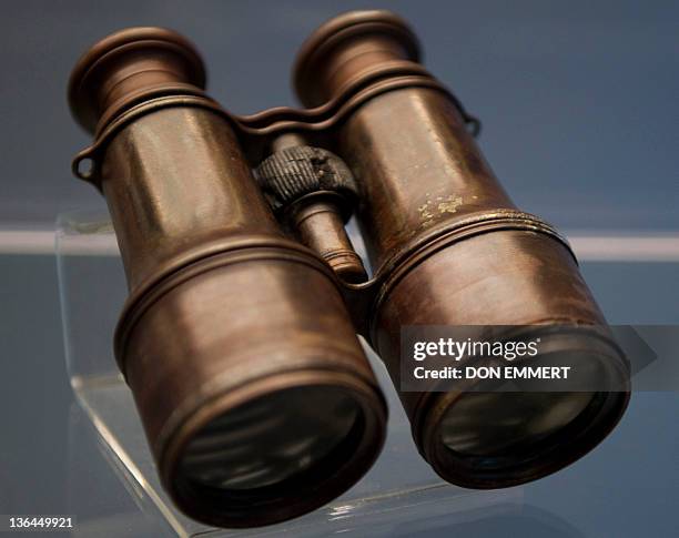 Pair of binoculars from the RMS Titanic is on display during a news conference by Guernsey's Auction House January 5, 2012 aboard the Intrepid Sea,...
