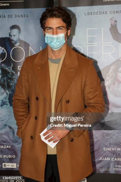 Actor and model Maxi Iglesias poses wearing a face mask at the photocall before the premiere of the Play 'El Perdón' starring Juana Acosta and Chevi...
