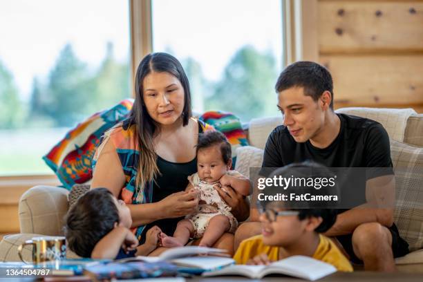 first nation family spending time together at home - inheemse bevolking stockfoto's en -beelden
