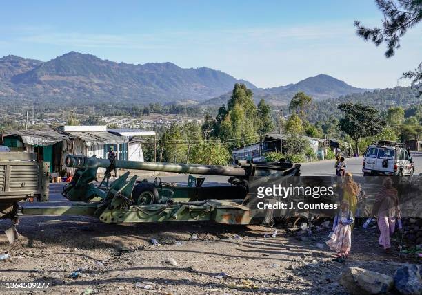 The wreckage of large artillery piece sits along the A2 road in the city of Haik on January 12, 2022 in the Wollo region, Ethiopia. Haik is one of...