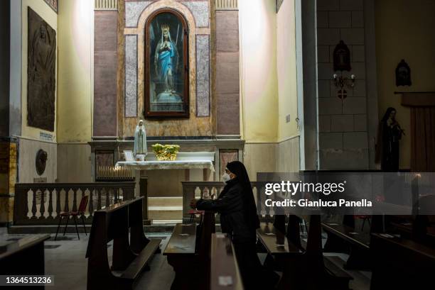 Nun prays before the torchlight procession in memory of the victims of the sinking of the Costa Concordia cruise ship on the 10th anniversary of the...