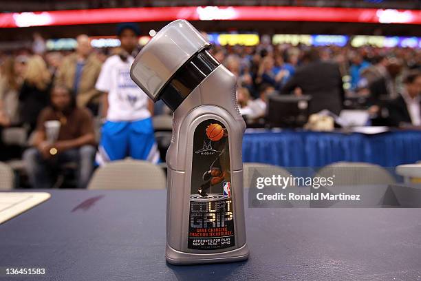 Bottle of Mission Court Grip on the scorer's table during a game between the Phoenix Suns and the Dallas Mavericks at American Airlines Center on...