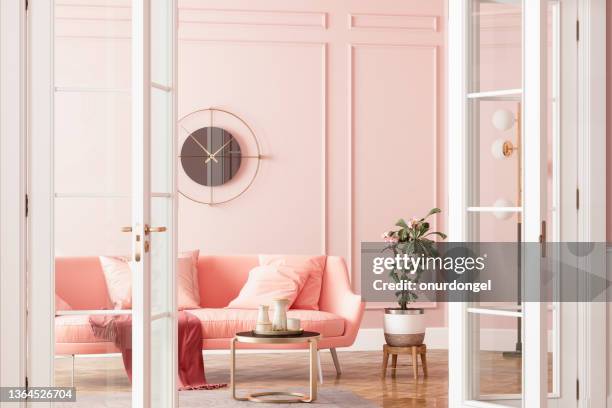 entrance of living room with pink sofa, potted plant and coffee table - pastel interior decor stock pictures, royalty-free photos & images