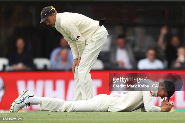 Joe Root and Zak Crawley of England looks dejected after Zak Crawley dropped Marnus Labuschagne of Australia during day one of the Fifth Test in the...