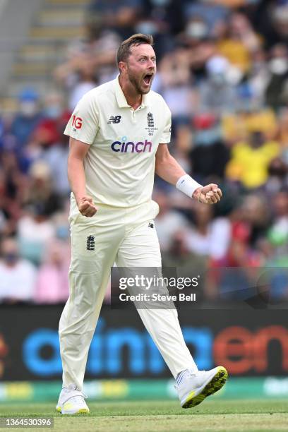 Ollie Robinson of England celebrates the wicket of Steven Smith of Australia during day one of the Fifth Test in the Ashes series between Australia...