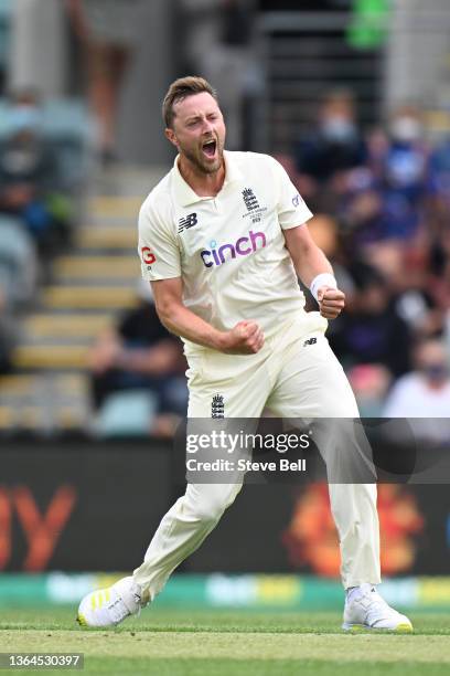 Ollie Robinson of England celebrates the wicket of Steven Smith of Australia during day one of the Fifth Test in the Ashes series between Australia...