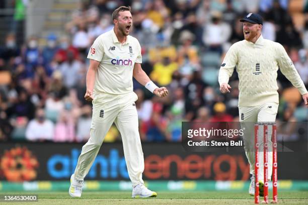 Ollie Robinson of England celebrates the wicket of Steven Smith of Australia during day one of the Fifth Test in the Ashes series between Australia...