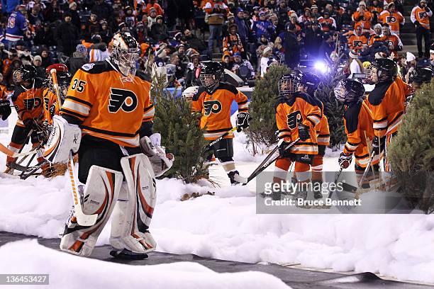 Sergei Bobrovsky of the Philadelphia Flyers walks to the ice during the 2012 Bridgestone NHL Winter Classic against the New York Rangers at Citizens...