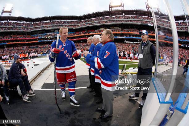 New York Rangers Brian Leetch and ambassadors Harry Howell, Ed Giacomin and Rod Gilbert and prior to the game against the Philadelphia Flyers at...