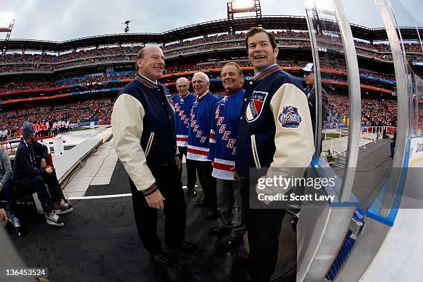 New York Rangers ambassadors Harry Howell, Ed Giacomin and Rod Gilbert with Rangers coaches Mike Keenan and Mike Richter prior to the game against...