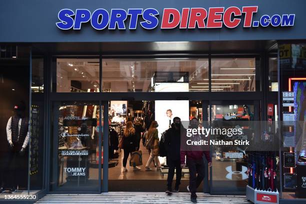 People exit from a Sports Direct store on January 13, 2022 in York, England.