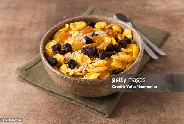 fresh granola, muesli with raisins. copy space. - corn flakes stock pictures, royalty-free photos & images