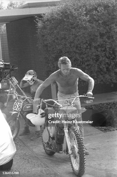 Portrait of celebrity actor Steve McQueen with his son, Chad McQueen, and his bike collection in his garage. Palm Springs, CA 6/13/1971 CREDIT: Heinz...