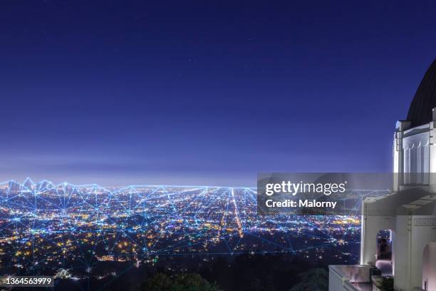 blockchain network spanning over the los angeles skyline. smart city - los angeles skyline stock pictures, royalty-free photos & images
