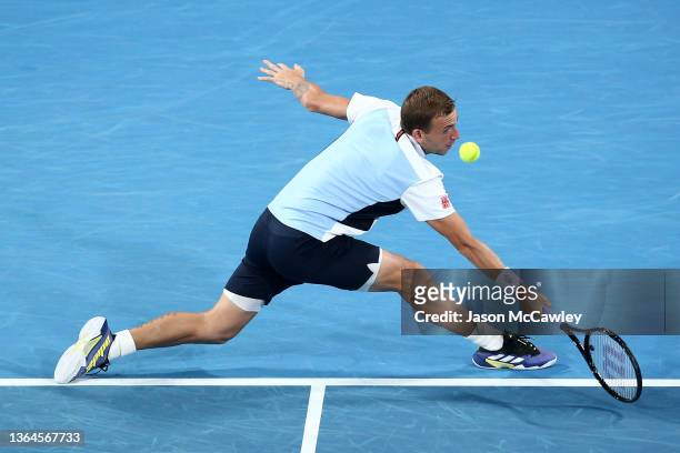 Daniel Evans of Great Britain hits a backhand in his semi final match against Aslan Karatsev of Russia during day six of the Sydney Tennis Classic at...