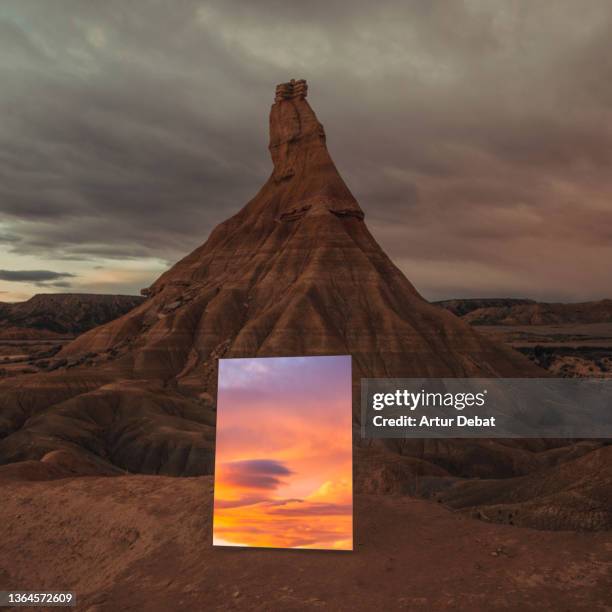 creative picture with mirror in the desert reflecting sunset sky. - mirror frame stock pictures, royalty-free photos & images