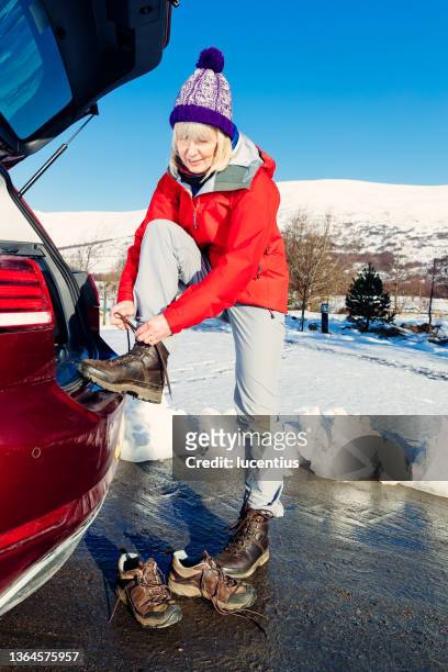 woman preparing for snowy hike in scottish highlands - winter sport walk old stock pictures, royalty-free photos & images