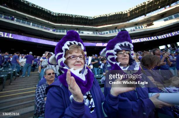 Kansas State fans Maleta Forsberg, left, and Kelsey Moncrief cheer during a pep rally in Arlington, Texas Thursday, January 5, 2012.