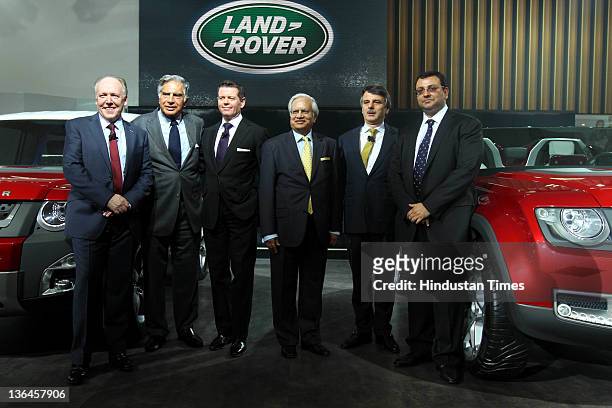 Chairman Ratan Tata with Cyrus Mistry , Deputy Chairman and Chairman-Designate of Tata Group, pose for photos at the Land Rover pavilion during 11th...