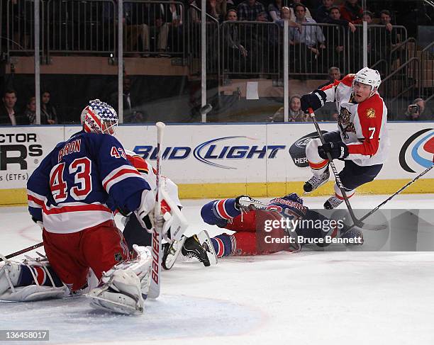 Martin Biron of the New York Rangers makes the third period save on Dmitry Kulikov of the Florida Panthers at Madison Square Garden on January 5,...
