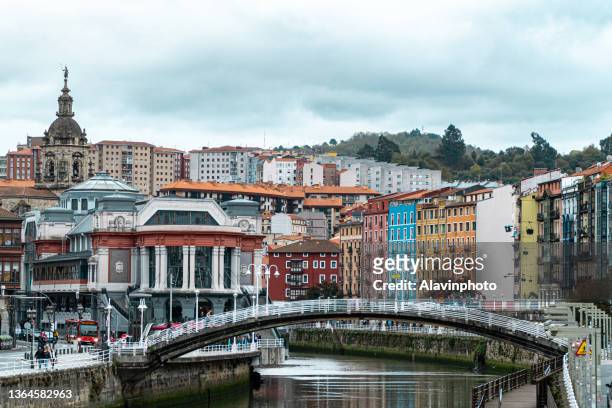 views of the old town of bilbao and the estuary - bilbao stock pictures, royalty-free photos & images