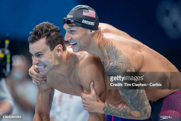 Blake Pieroni and Caeleb Dressel of the United States react during the teams gold medal victory in the Men's 4 x 100m Freestyle Relay Final during...