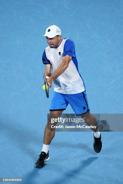 Aslan Karatsev of Russia hits a backhand in his semi final match against Daniel Evans of Great Britain during day six of the Sydney Tennis Classic at...