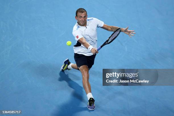 Daniel Evans of Great Britain hits a backhand in his semi final match against Aslan Karatsev of Russia during day six of the Sydney Tennis Classic at...