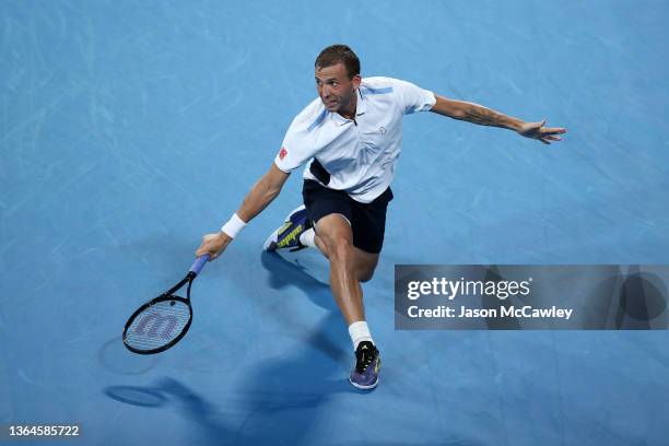 Daniel Evans of Great Britain hits a backhand in his semi final match against Aslan Karatsev of Russia during day six of the Sydney Tennis Classic at...