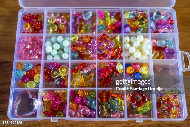 close-up of a box full of plastic beads - bead necklace stock pictures, royalty-free photos & images