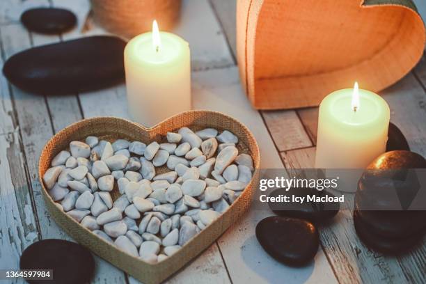 zen and romantic atmosphere of small homemade biscuits for a snack or a breakfast in relaxation mode, to be taken alone or as a couple for valentine's day - couple dark background stock-fotos und bilder