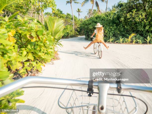 pov point of view of couple cycling on tropical island - maldives sport stock pictures, royalty-free photos & images