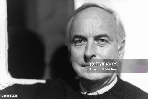 Close-up of American film director James Ivory as he poses in the offices of the offices of Merchant Ivory Productions, London, England, 1987.